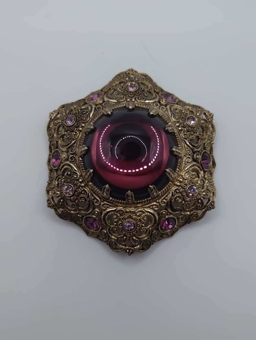 Western Germany Filigree, Purple Glass Cabachon, and Purple Rhinestone Brooch - Picture 1 of 7